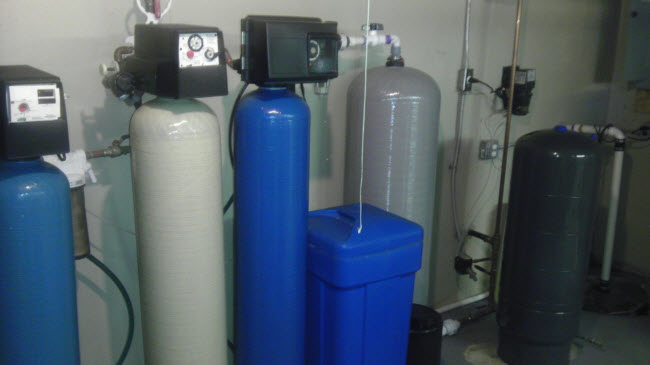 Multiple stage well water treatment system