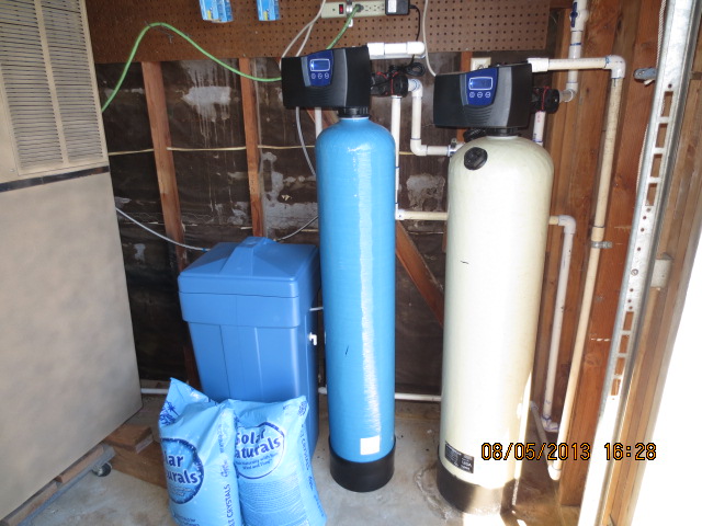 Calcite neutralizer neutralizes acid water pH. Softener removes hardness minerals for clean water throughout the home.